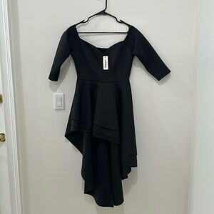 Size large long top in black color.